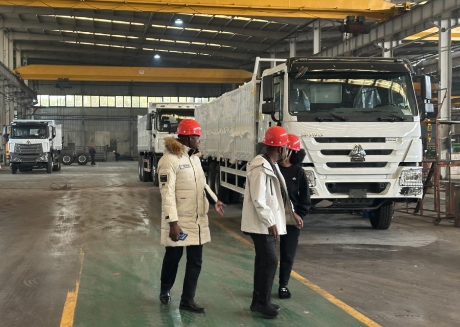 Customers visit our production line and finished trucks.jpg
